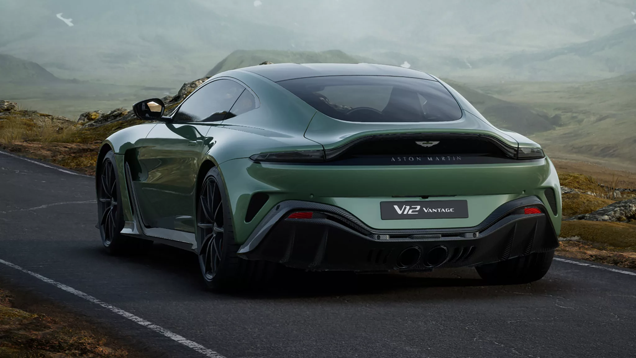 A side profile of the new Aston Martin Vantage parked outside an exclusive luxury estate