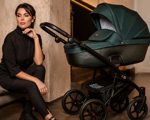An elegant luxury baby stroller with premium leather and aluminum details parked on a city sidewalk