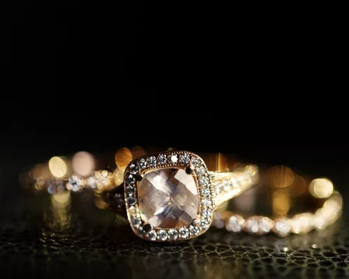 Diamond halo engagement ring with bokeh lighting — luxury jewelry Houston