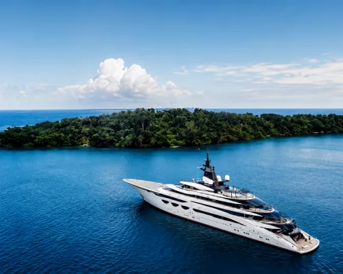 The majestic 115-meter Lürssen superyacht AHPO cruising on calm, deep blue Mediterranean waters