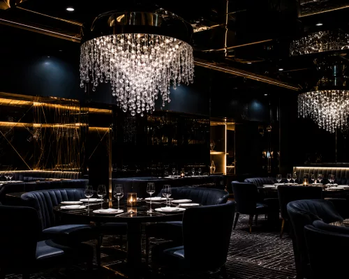 An ultra-luxury multi-sensory dining room setup with dramatic overhead projections and fine dining courses